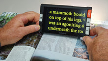 Load image into Gallery viewer, Clover 6 being used to read a book