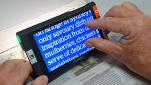Load image into Gallery viewer, Clover 6 reading a newspaper